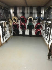 Saddles in tack room